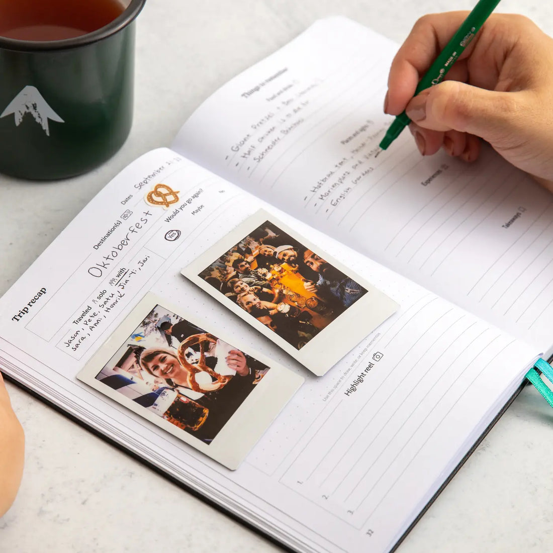 Person writing in travel journal about Oktoberfest