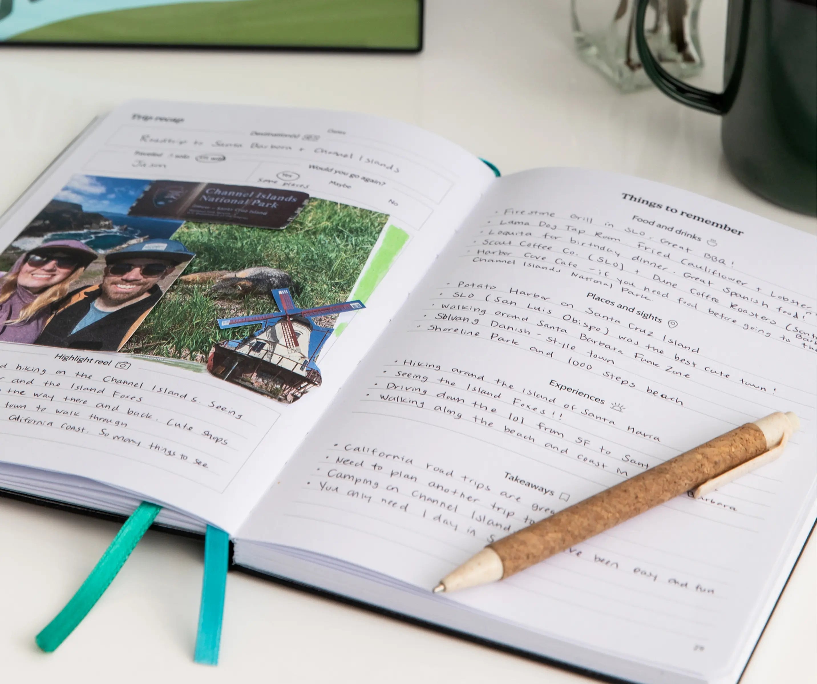 Filled out travel journal pages with handwritten notes and photos on a desk